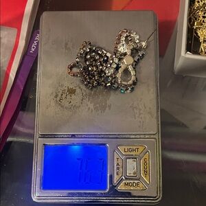 Gold earrings and necklace with stones